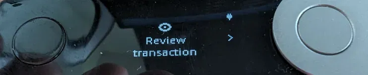 Ledger device screen: Review transaction